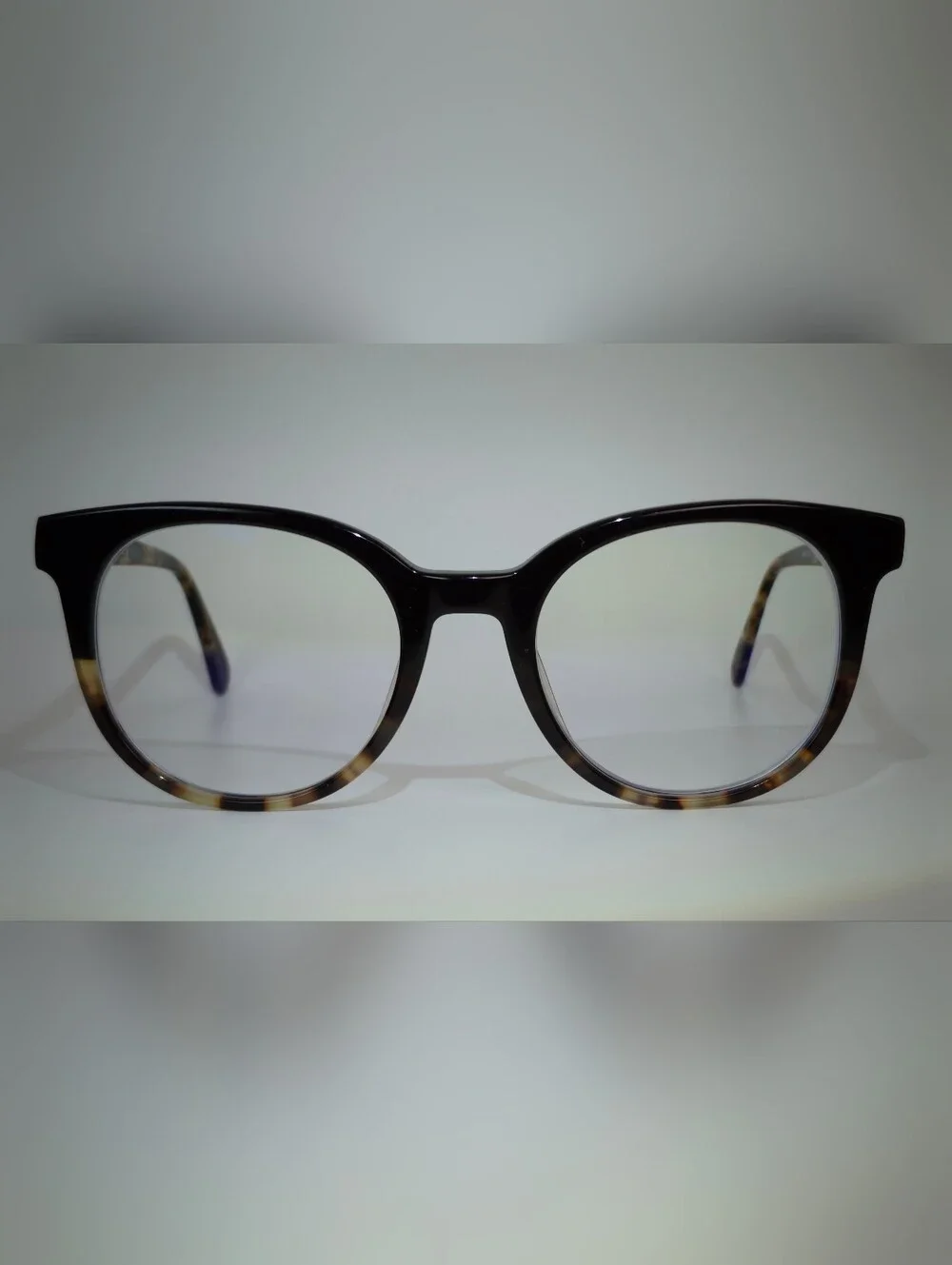 Rialto. Classic Round Black Upper, Animal Print Lower And Temples.